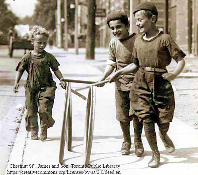 Boys rolling hoops ca. 1922