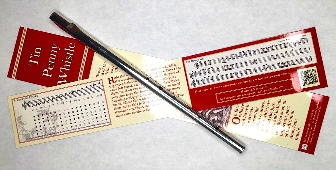 Traditional tin penny whistle with packaging